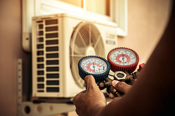 Professional Air Conditioning Service technician working in Brighton, CO